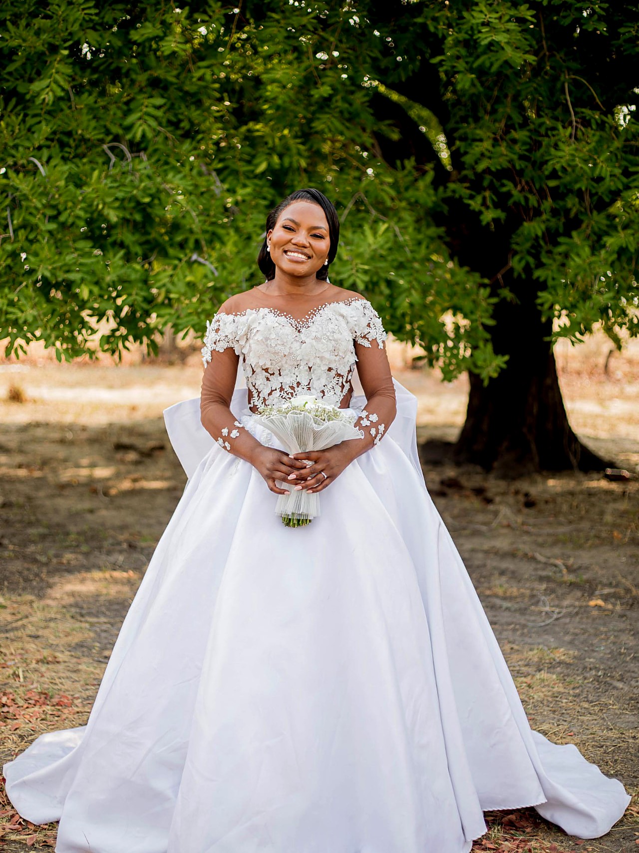 Foxxy bride in a mikado silk ball gown with lace illusion bodice